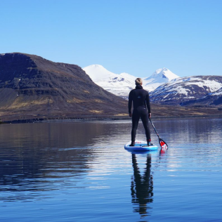 Paddle is a water sport in Iceland for summer
